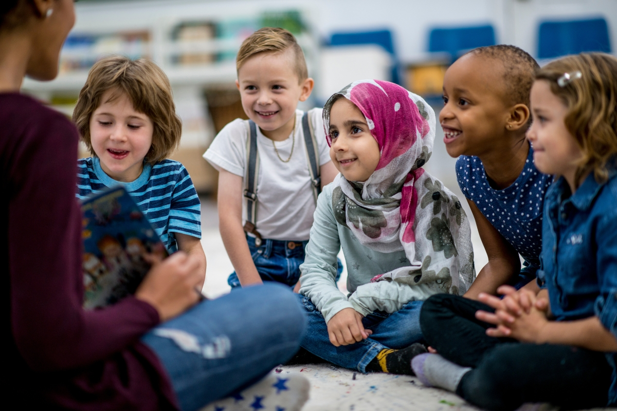 Children in Islamic classroom learning Quran or Arabic