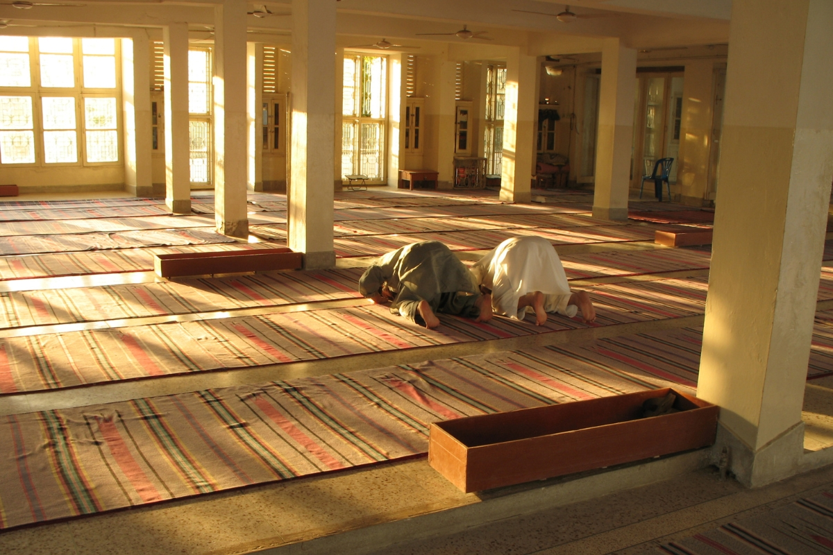Interior of a beautiful masjid prayer hall with Islamic architecture